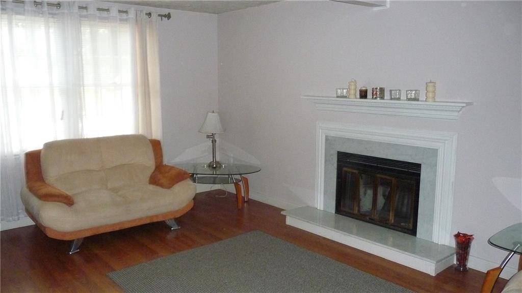 380 Shady Ridge Drive Monroeville, PA 15146 - Photo 6 of 21 Living room has updated flooring and brings the room together with the gas fireplace