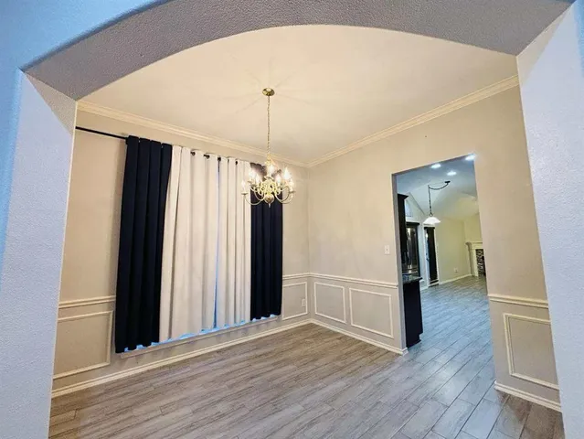 a view of a hallway view with wooden floor and staircase