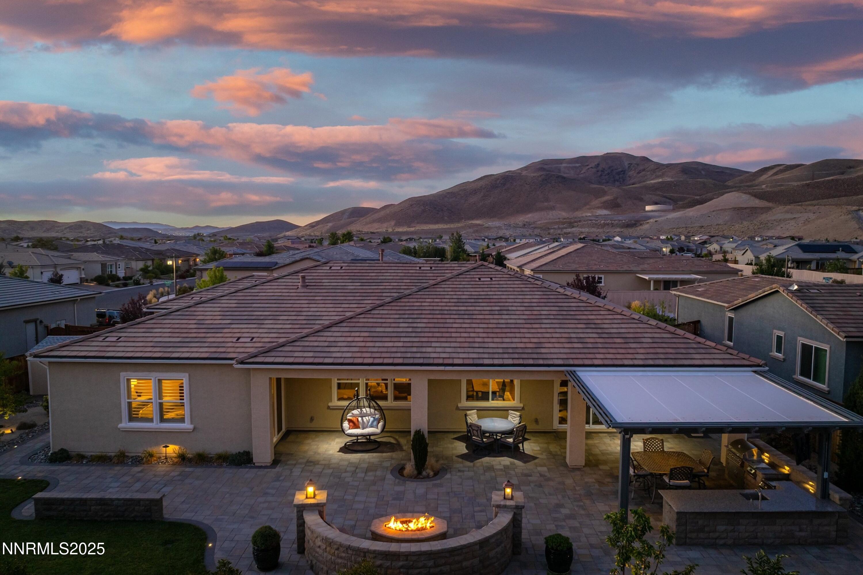 2910 Hasufel Way Reno, NV 89521 - Photo 1 of 46 a view of a big house with a table and chairs in a yard