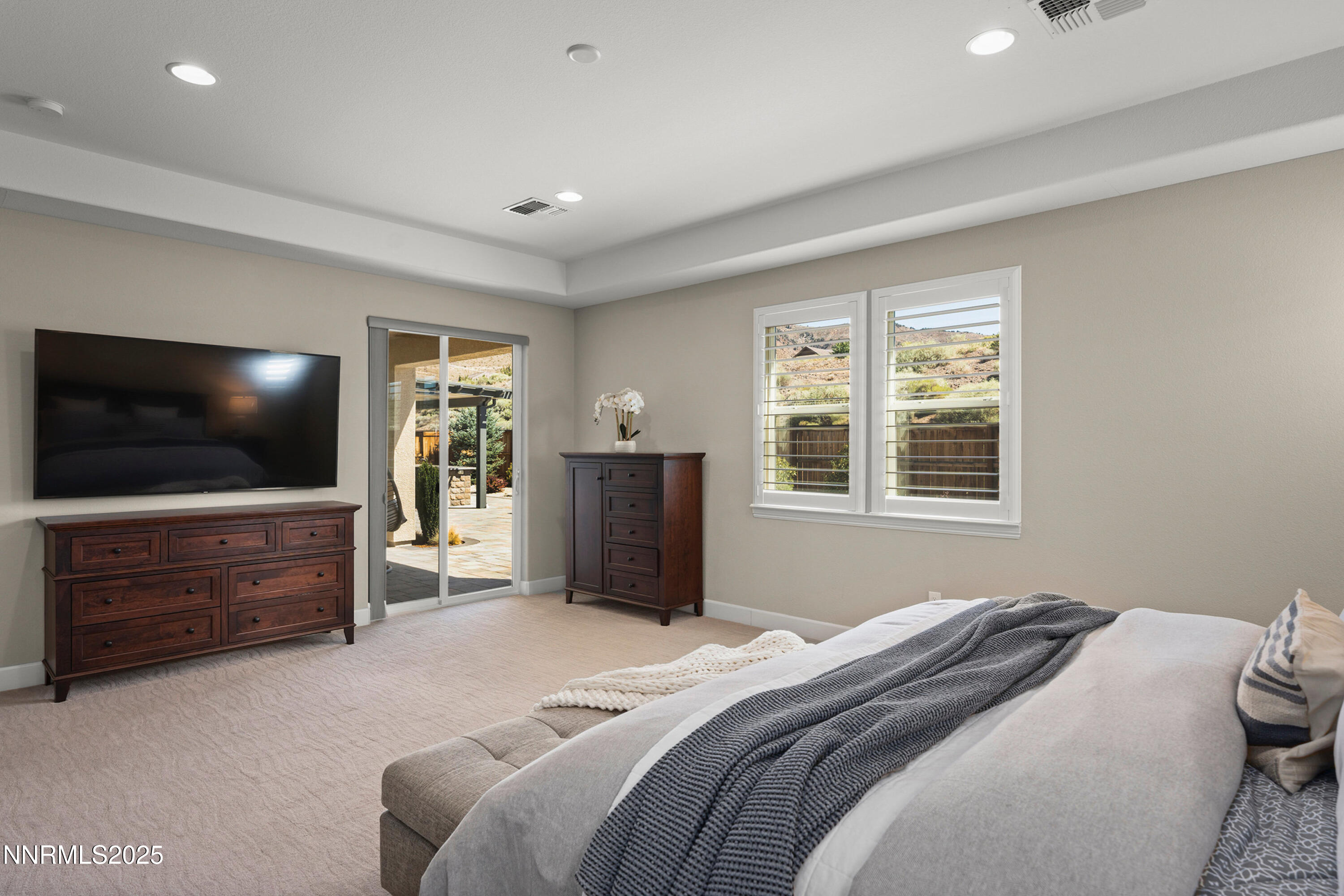 2910 Hasufel Way Reno, NV 89521 - Photo 17 of 46 a bedroom with a bed and a flat screen tv