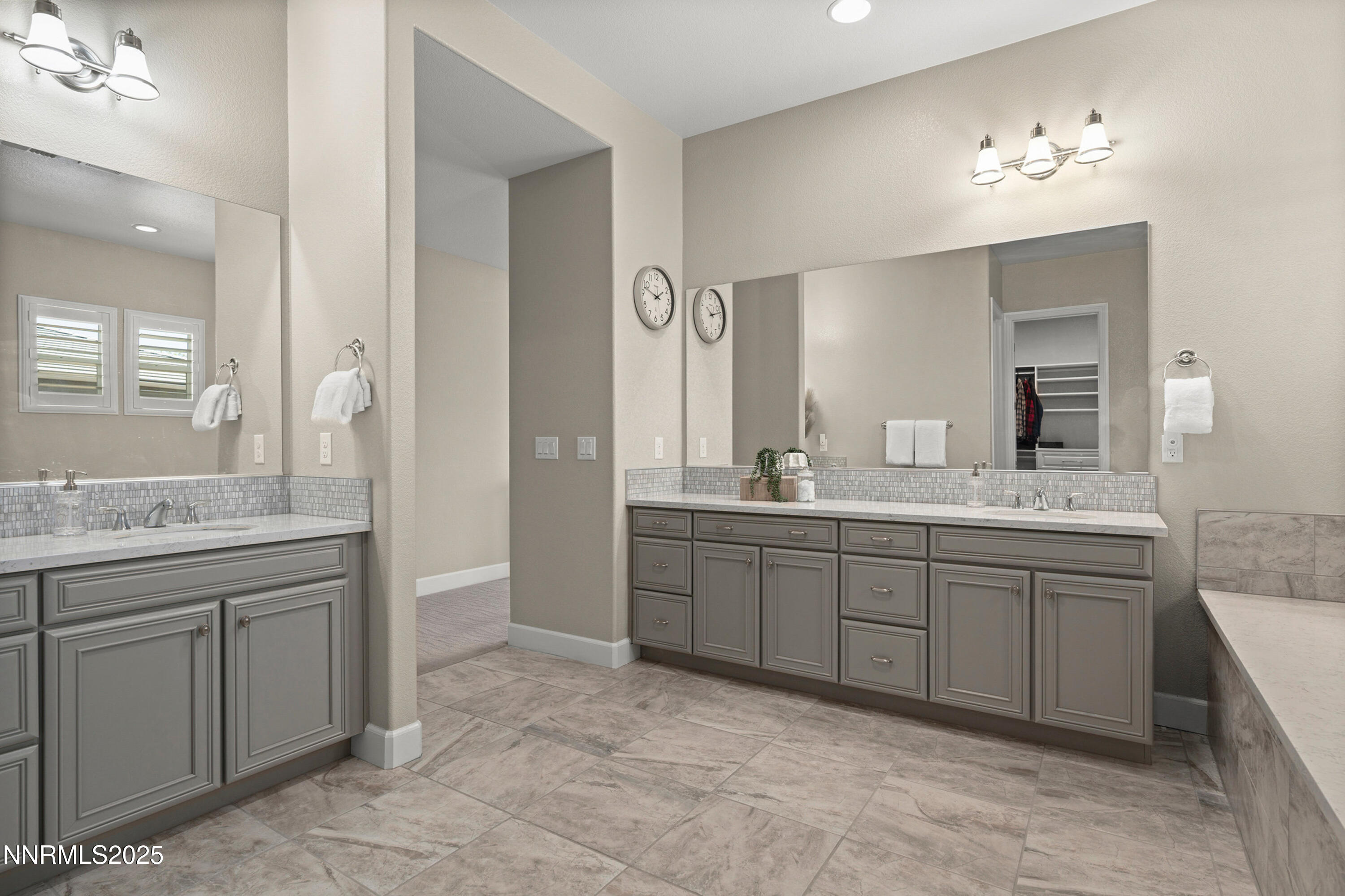 2910 Hasufel Way Reno, NV 89521 - Photo 18 of 46 a spacious bathroom with a granite countertop sink a mirror and a