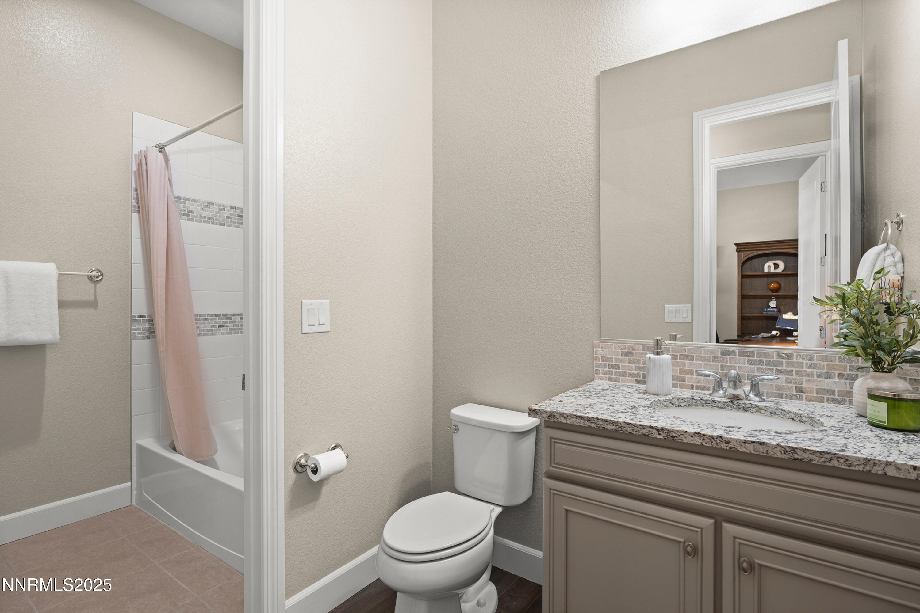 2910 Hasufel Way Reno, NV 89521 - Photo 24 of 46 a bathroom with a granite countertop sink toilet and shower