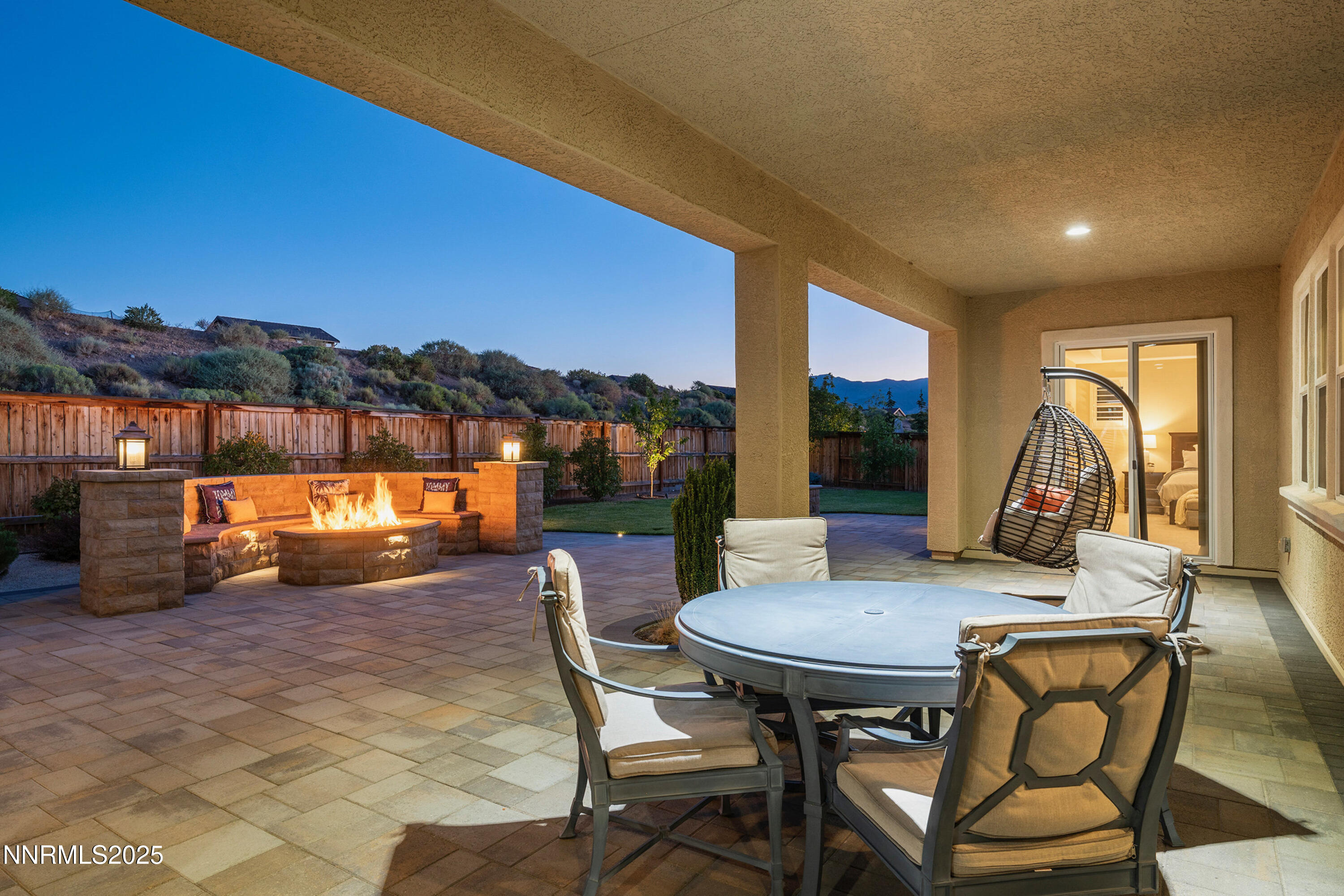 2910 Hasufel Way Reno, NV 89521 - Photo 29 of 46 a view of a patio with a table and chairs next to a yard