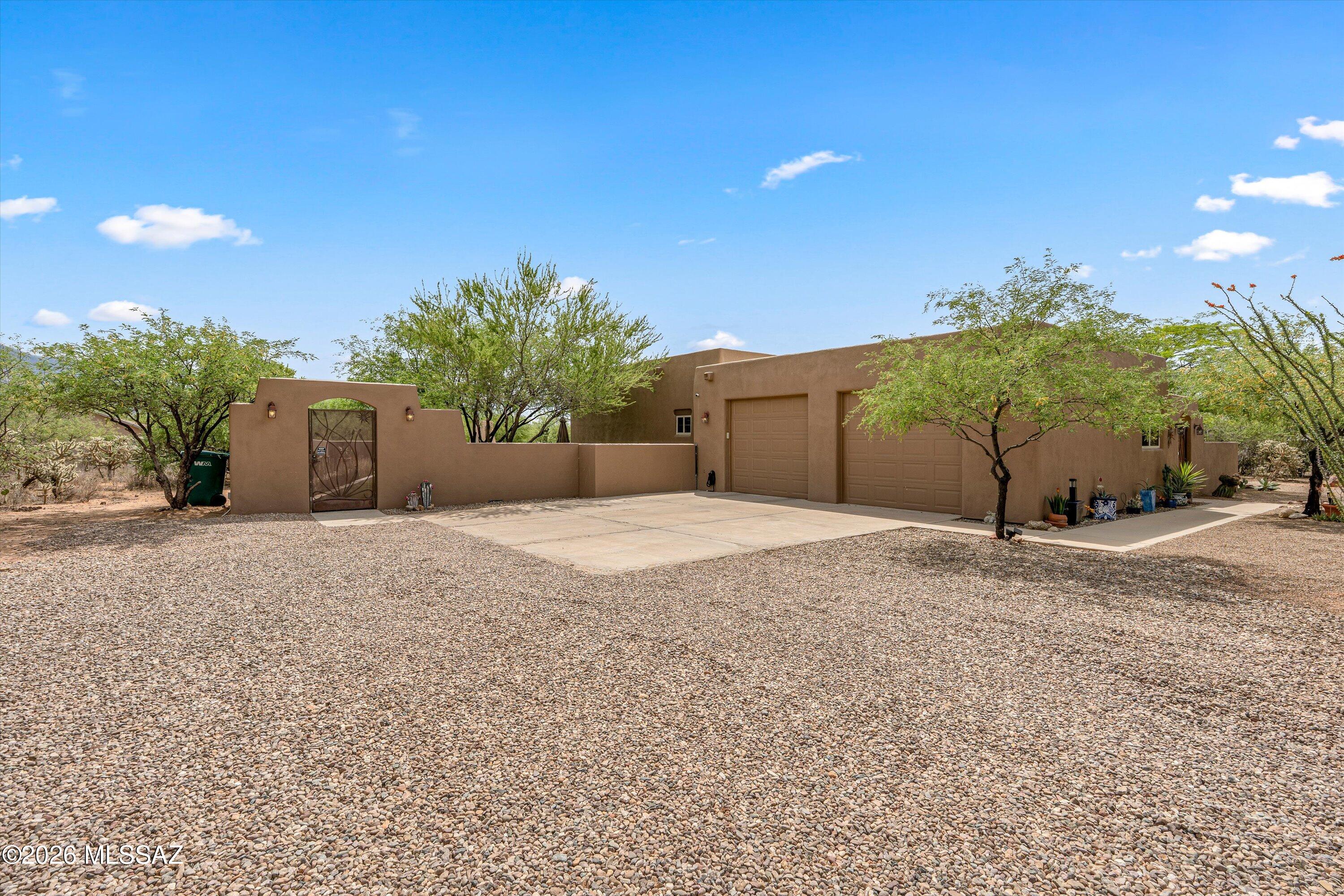 4760 East Wagon Train Road Tucson, AZ 85739 - Photo 34 of 38 a view of a backyard of a house