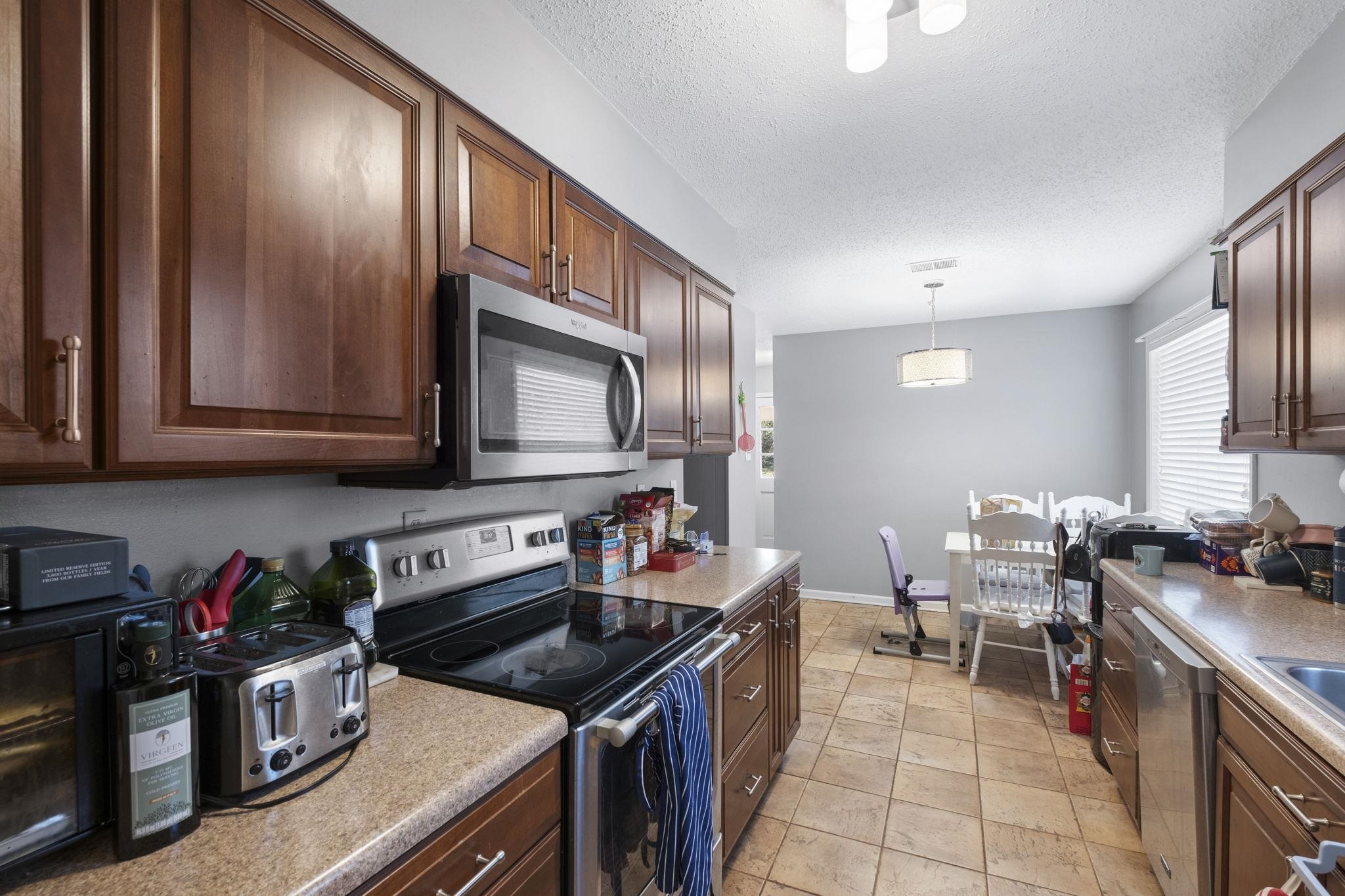 461 Dove Valley Road Collierville, TN 38017 - Photo 26 of 40 a kitchen with a stove and a microwave