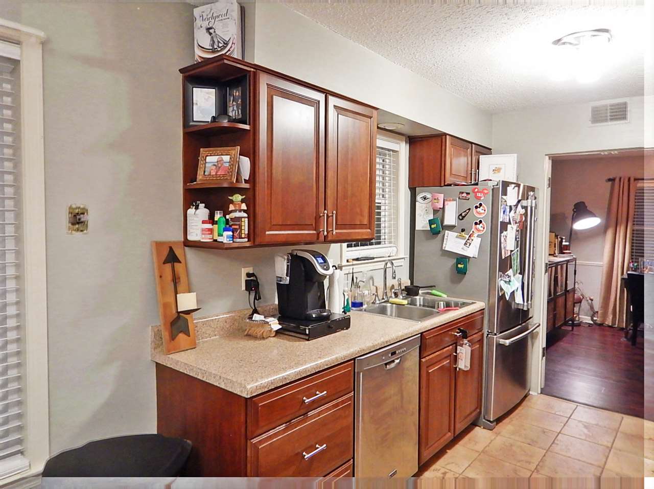 461 Dove Valley Road Collierville, TN 38017 - Photo 8 of 40 a kitchen with stainless steel appliances granite countertop a sink stove and cabinets