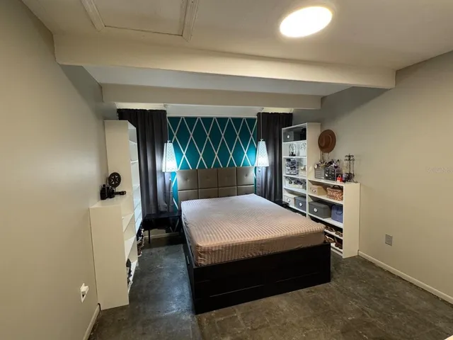 a bed room with a bed and a window