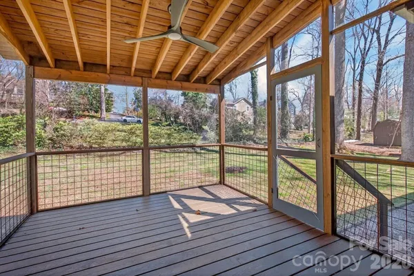 a view of porch with wooden floor