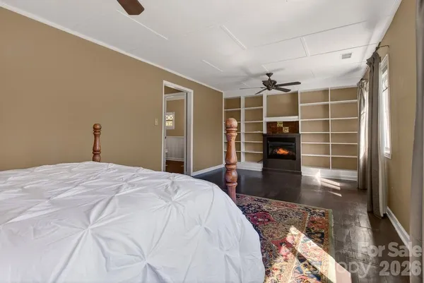 a bed room with a bed and a television