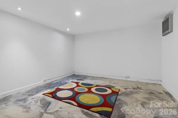 a kitchen with a refrigerator and a sink