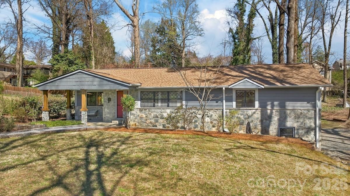 95 Whitney Avenue Tryon, NC 28782 - Photo 3 of 31 a front view of a house with a yard