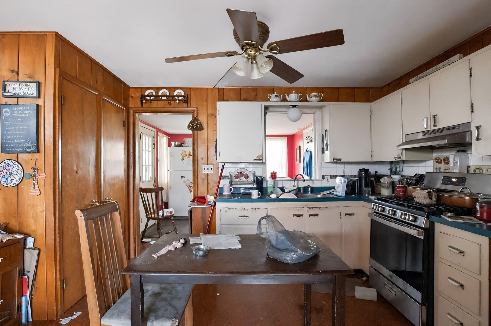 1622 Chicago Street Dixon, IL 61021 - Photo 12 of 31 a kitchen with stainless steel appliances granite countertop a stove refrigerator dining table and chairs