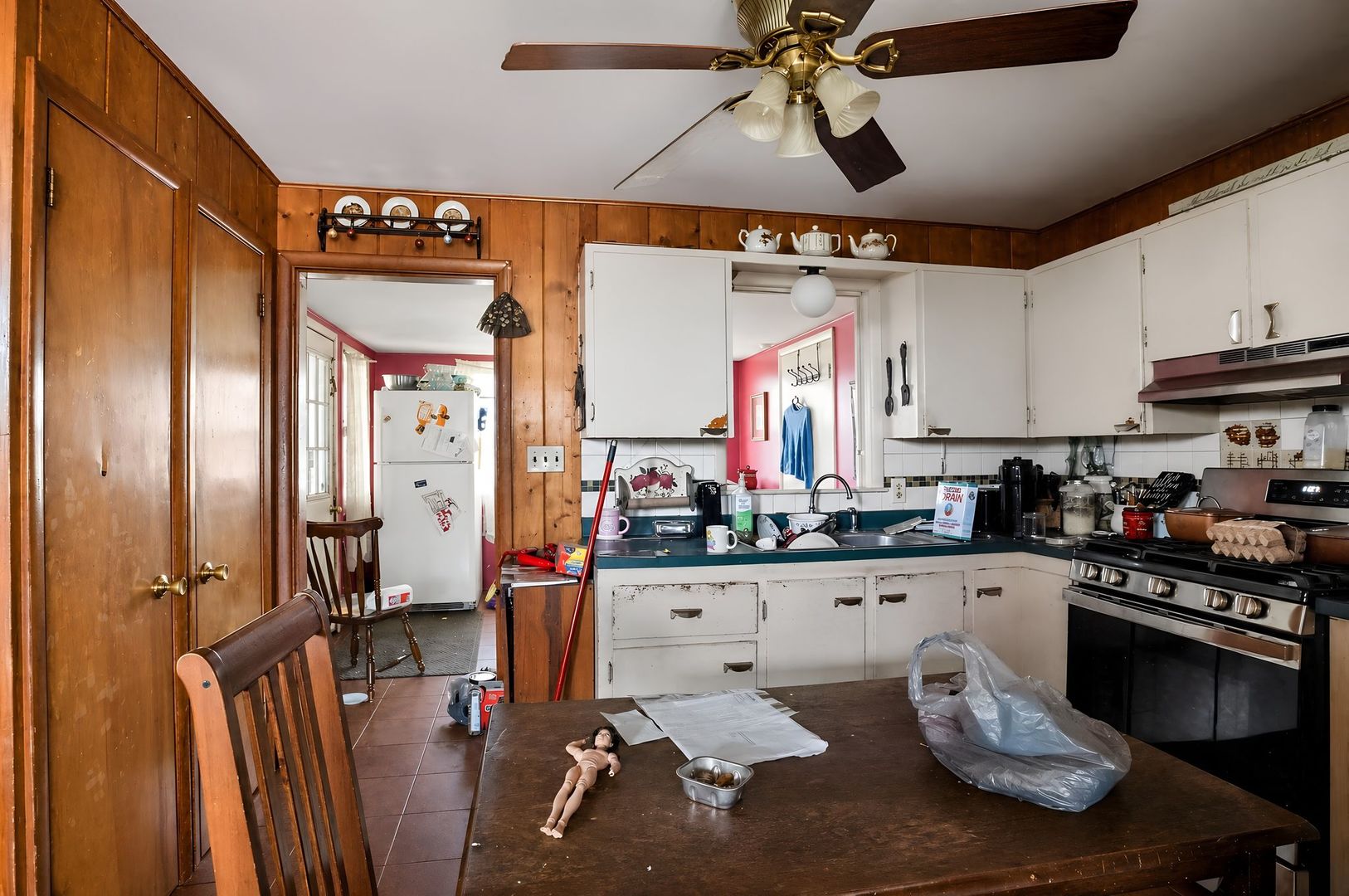 1622 Chicago Street Dixon, IL 61021 - Photo 14 of 31 a kitchen with stainless steel appliances kitchen island granite countertop a stove and white cabinets