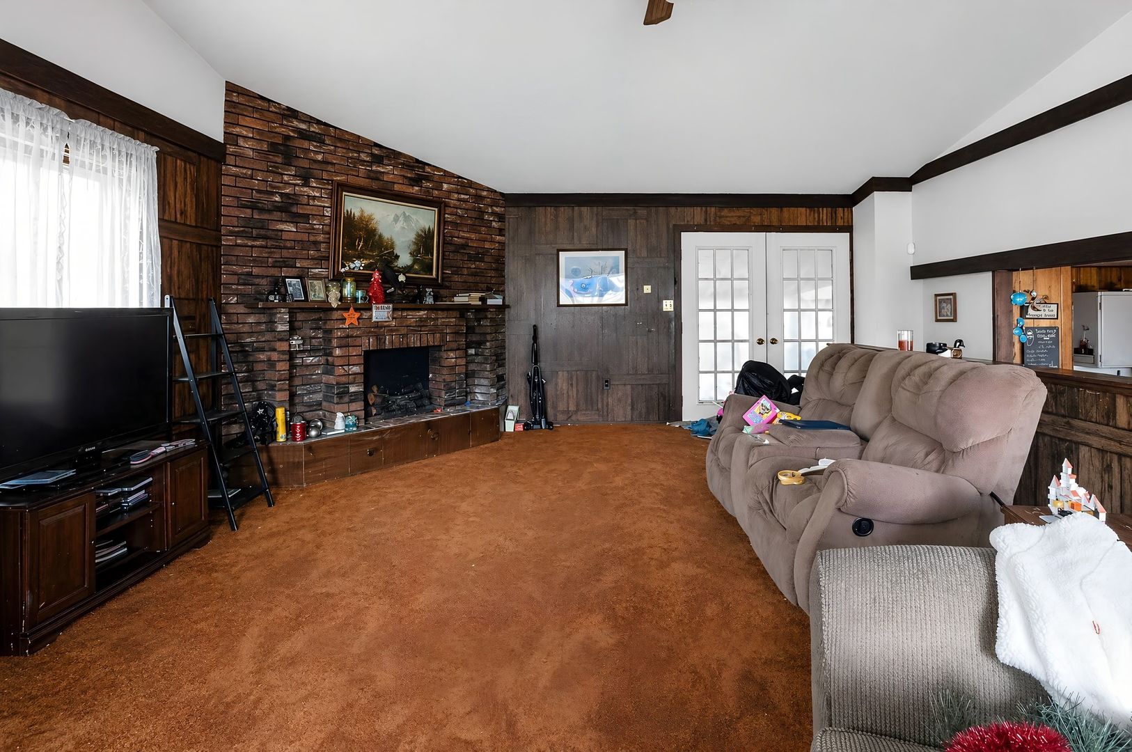 1622 Chicago Street Dixon, IL 61021 - Photo 7 of 31 a living room with furniture and a flat screen tv