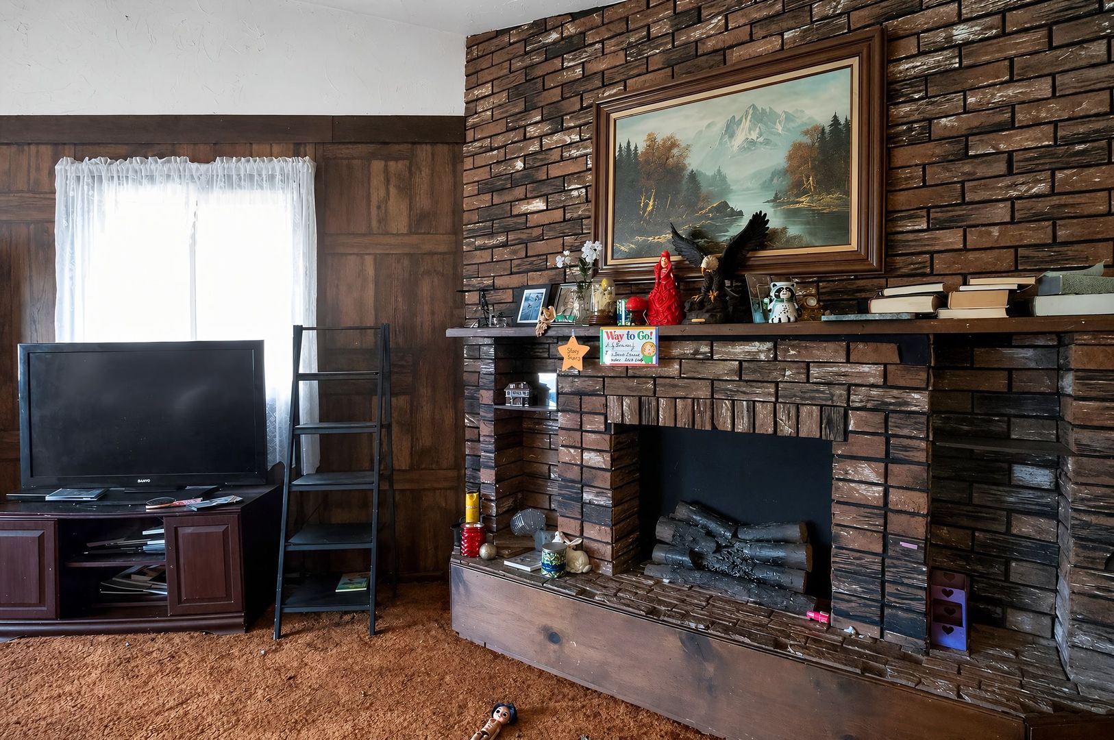 1622 Chicago Street Dixon, IL 61021 - Photo 10 of 31 a living room with fireplace and a flat screen tv