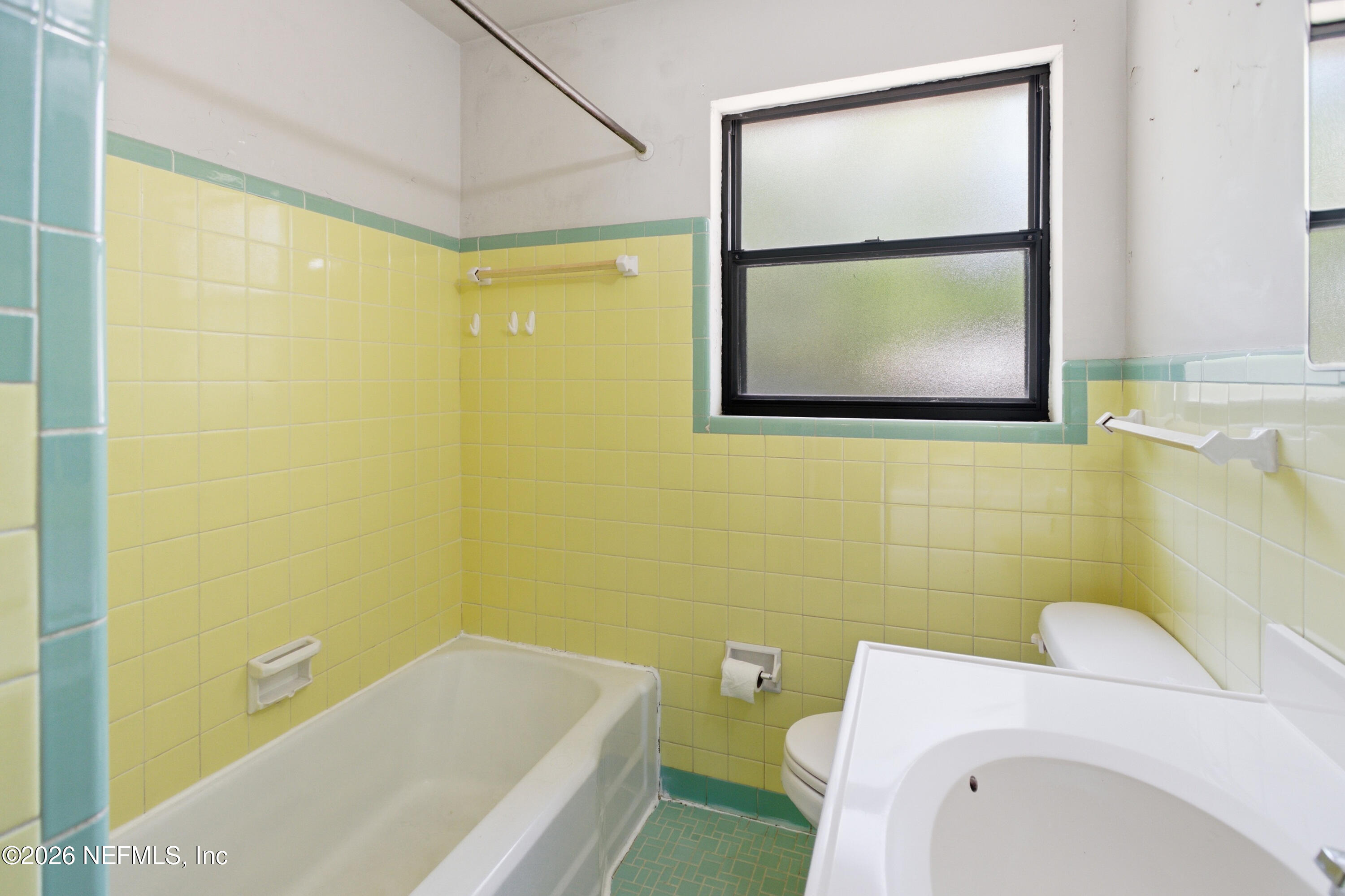 6818 Merrill Road Jacksonville, FL 32211 - Photo 14 of 21 a bathroom with a toilet and a sink