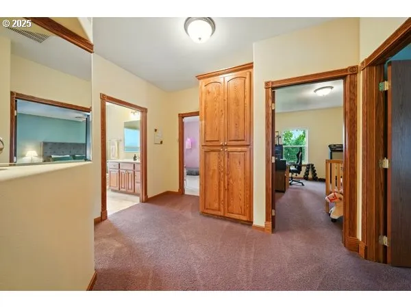 a bathroom with a sink a toilet and a large mirror