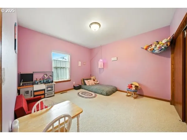 a bedroom with furniture and a window