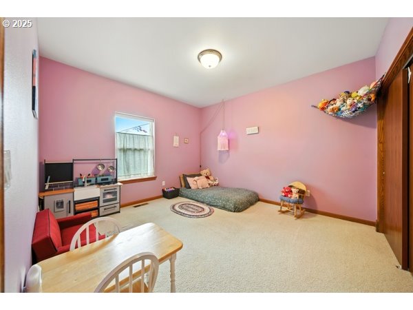 84634 Winesap Road Milton Freewater, OR 97862 - Photo 20 of 46 a bedroom with furniture and a flat screen tv