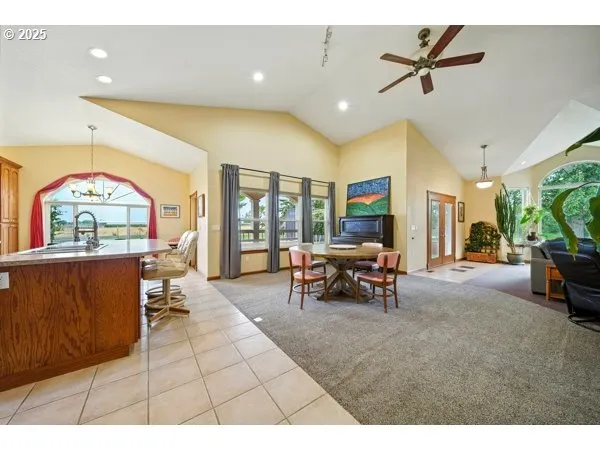 a kitchen with stainless steel appliances granite countertop a sink a oven and a refrigerator