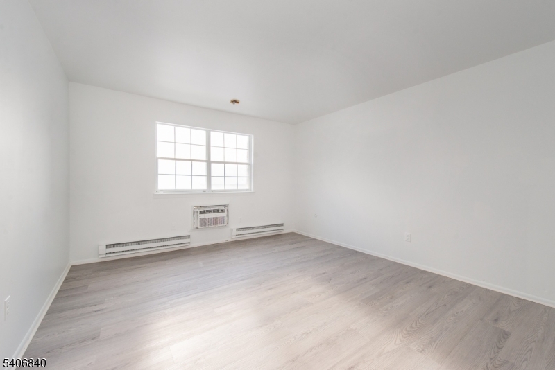 322 Richard Mine Road, Unit F5 Wharton, NJ 07885 - Photo 16 of 22 an empty room with windows