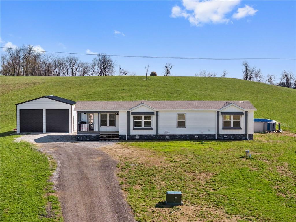 1350 Beham Ridge Road West Alexander, PA 15376 - Photo 2 of 48 a house with swimming pool in front of it
