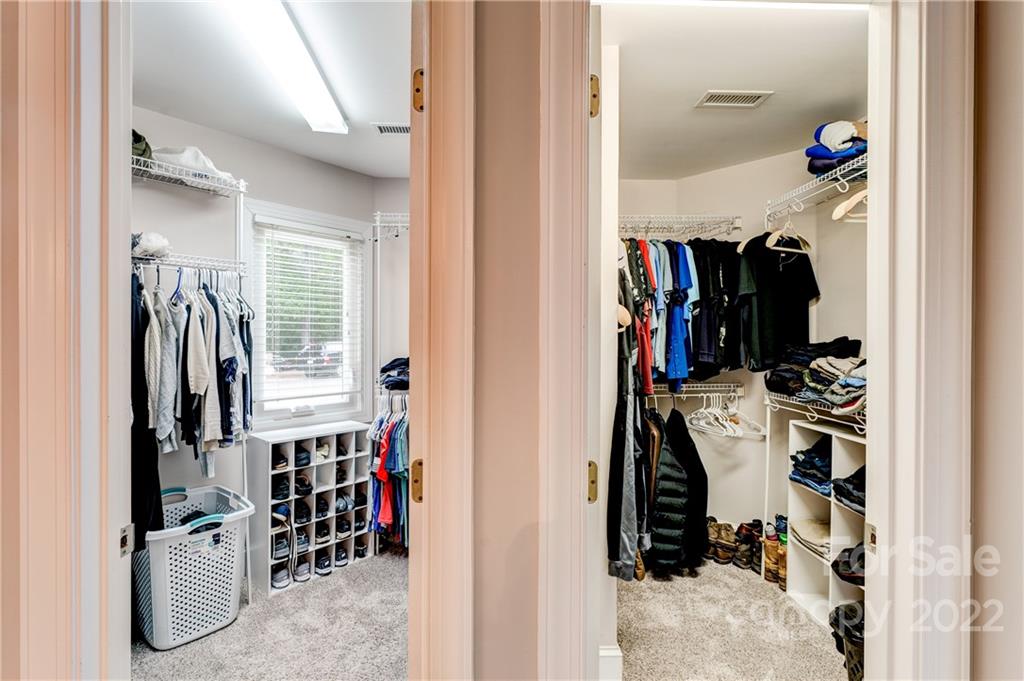 4027 Windward Drive Tega Cay, SC 29708 - Photo 27 of 44 a view of walk in closet with clothes and shoes