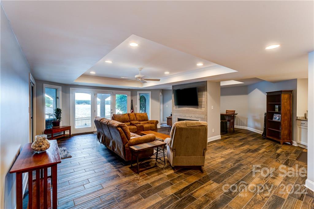 4027 Windward Drive Tega Cay, SC 29708 - Photo 34 of 44 a living room with furniture and a flat screen tv