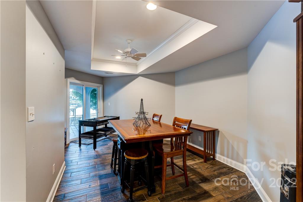 4027 Windward Drive Tega Cay, SC 29708 - Photo 36 of 44 a view of a dining room with furniture and wooden floor