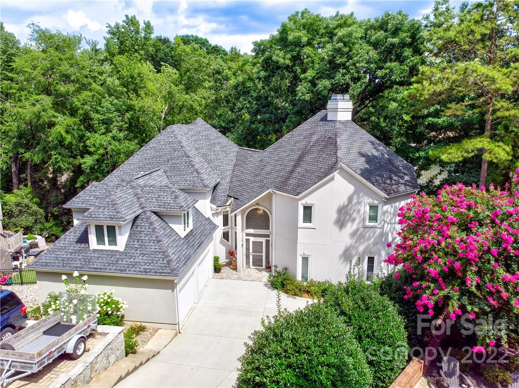 4027 Windward Drive Tega Cay, SC 29708 - Photo 7 of 44 a aerial view of a house with a yard and fountain in middle of the house