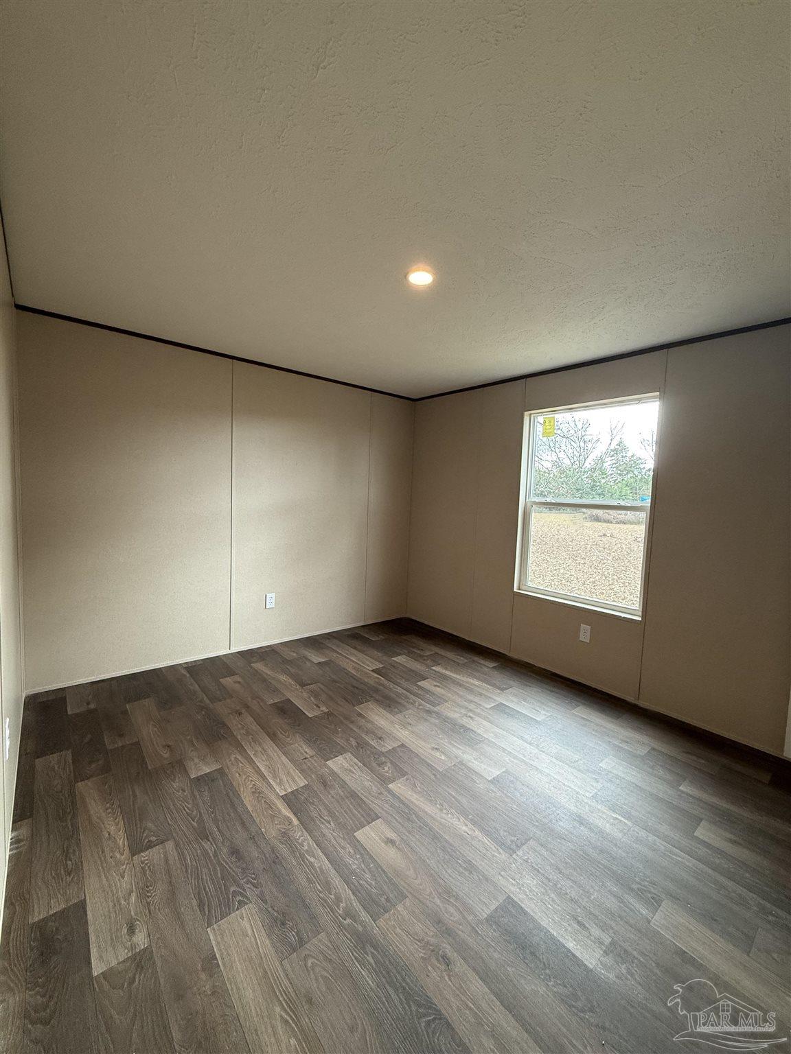 4468 Custer Lane Jay, FL 32565 - Photo 11 of 16 an empty room with windows