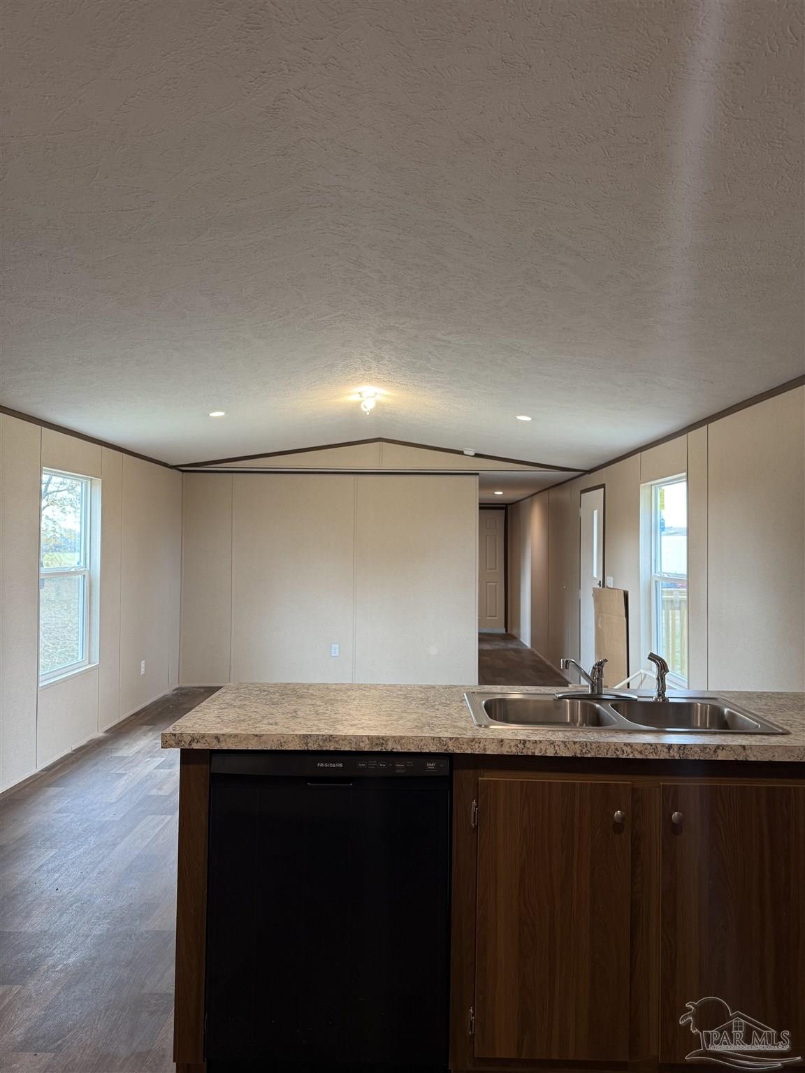 4468 Custer Lane Jay, FL 32565 - Photo 10 of 16 a kitchen with granite countertop a sink and cabinets