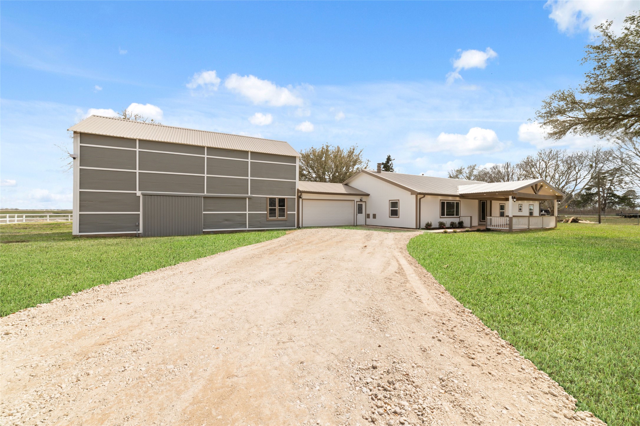 13431 Vrlla Road Guy, TX 77444 - Photo 24 of 32 a front view of a house with a yard and garage