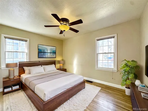 a bedroom with a large bed and a window