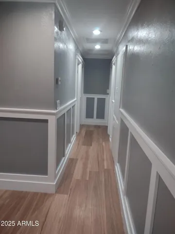 a view of gallery with wooden floor