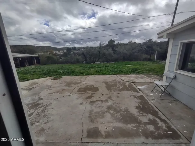 a backyard of a house with lots of green space