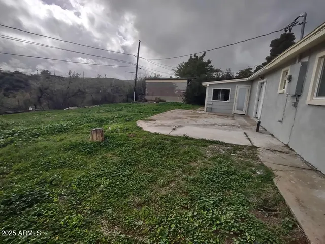 front view of a house with a big yard