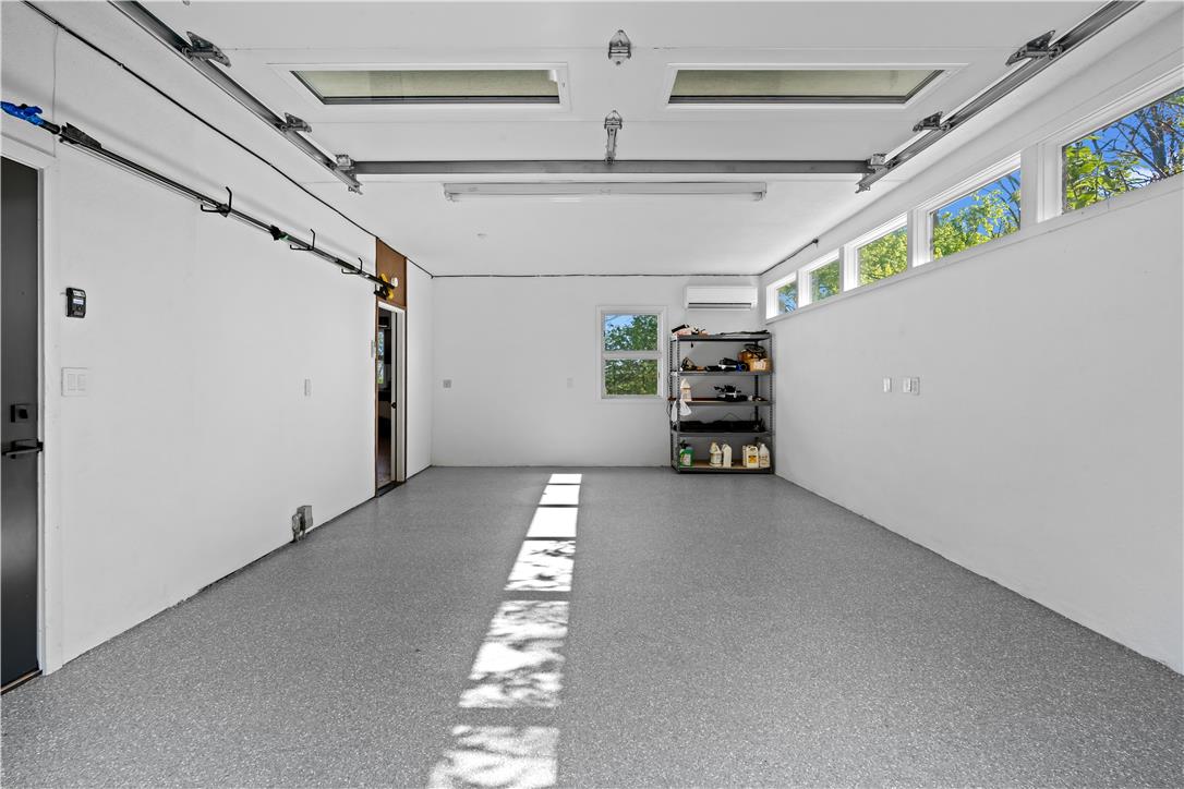 1506 Pleasant View Road Coopersburg, PA 18036 - Photo 78 of 97 A well-lit garage offers ample space and overhead lighting, ensuring practicality and convenience.