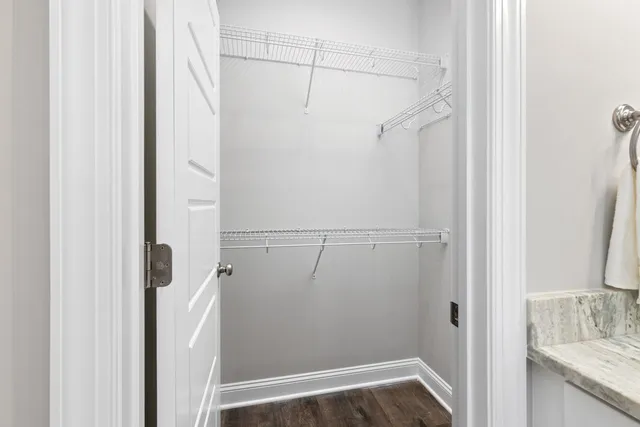 a view of storage and utility room with racks on the wall