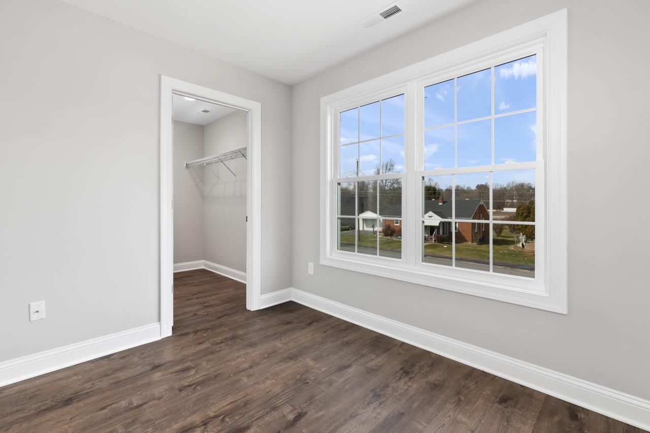 1013 B Street Waynesboro, VA 22980 - Photo 19 of 27 an empty room with wooden floor and windows