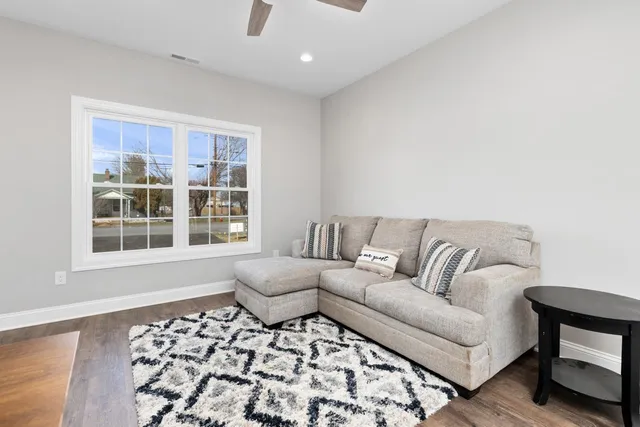a living room with a couch and a window