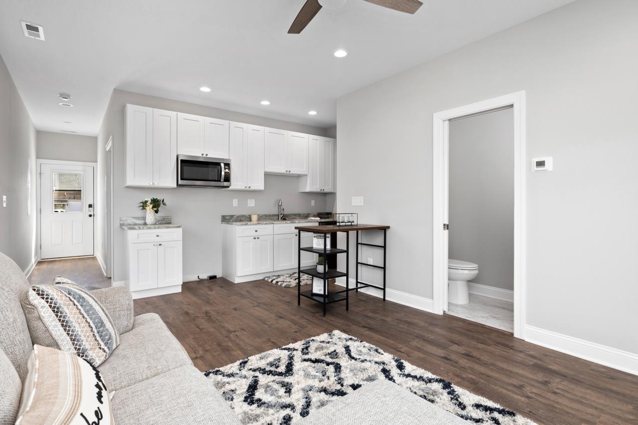1013 B Street Waynesboro, VA 22980 - Photo 4 of 27 a living room with stainless steel appliances furniture or couch and a kitchen view