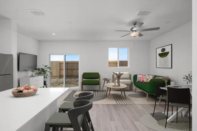 a view of a livingroom with furniture and a potted plant