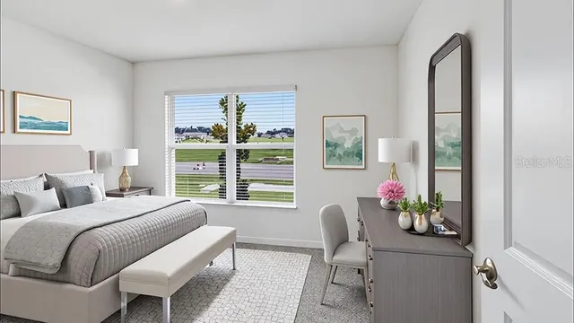 a bedroom with a bed and a chair