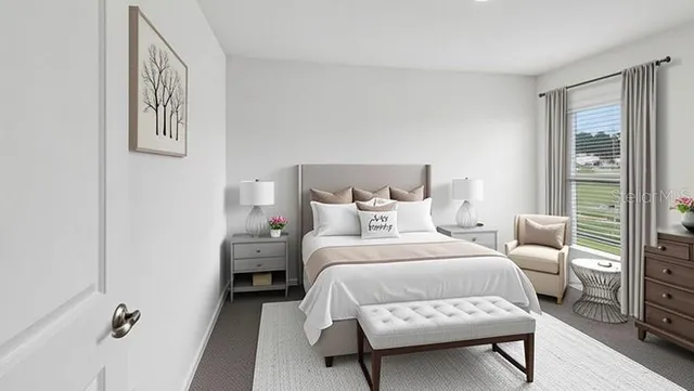 a bedroom with a bed and a night stand