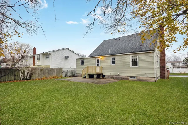 a house view with a sitting space and garden