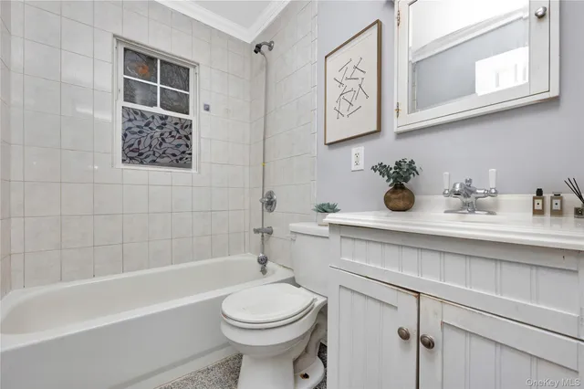 a bathroom with a sink a toilet and bathtub