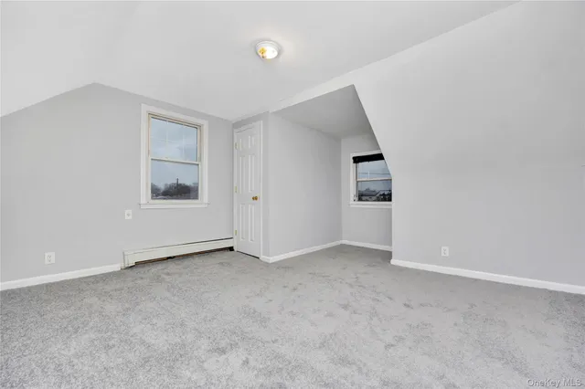 an empty room with a bathroom