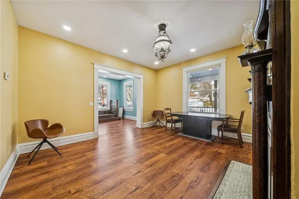 a view of a dining room with furniture window and wooden floor