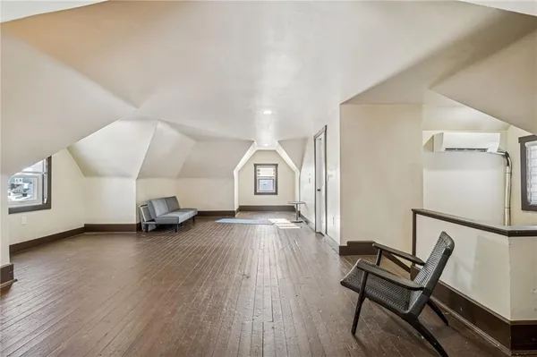 a view of a livingroom with furniture and wooden floor